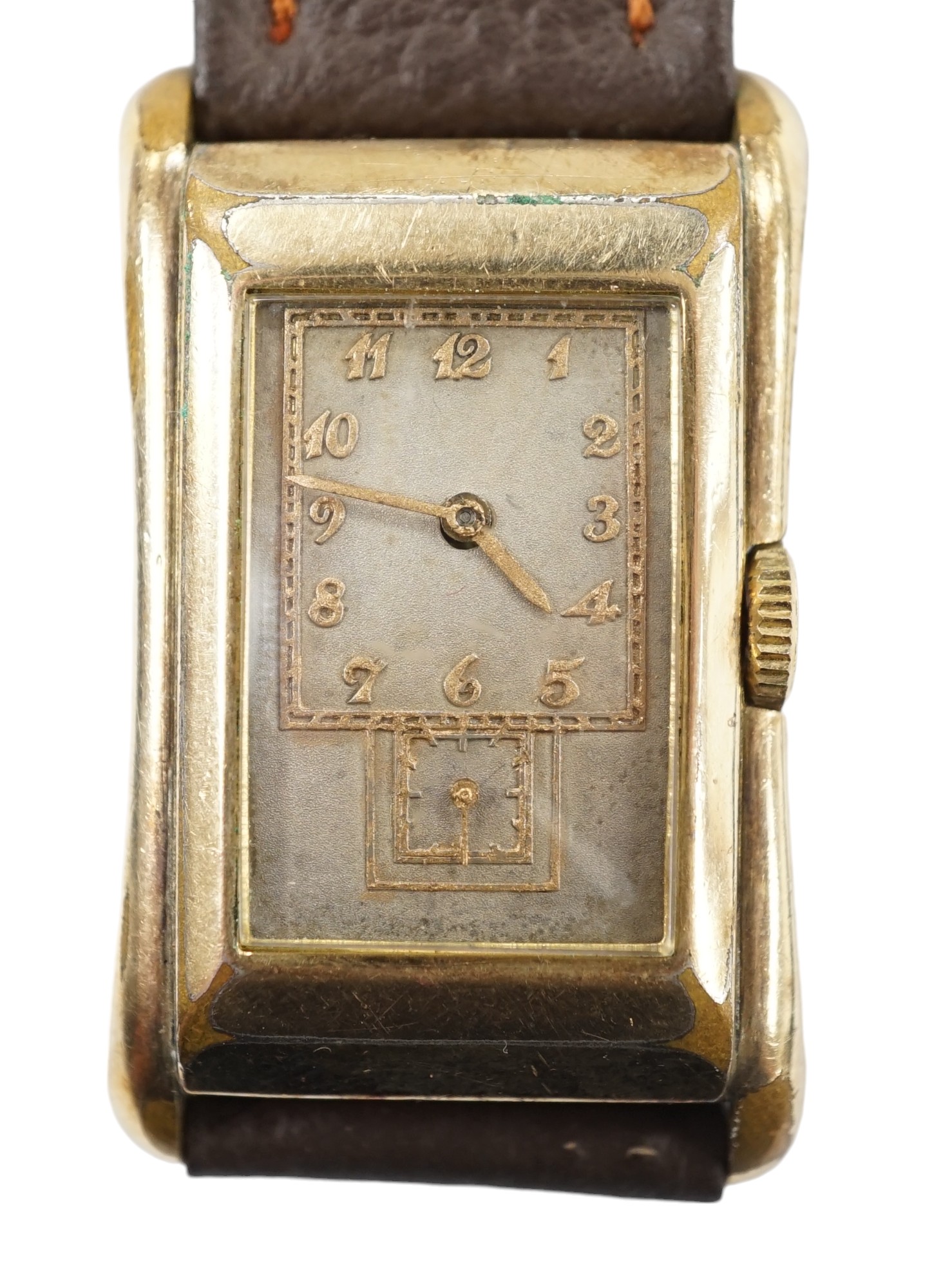 A gentleman's vintage Gruen 'Prince-style' wrist watch, in gilt case engraved 'Rolex 14k gold filled', with silvered dial, raised gilt arabic numerals and subsidiary seconds. The movement with the original Gruen naming d